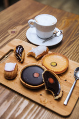 Cappuccino with lemon and dark chocolate tarts