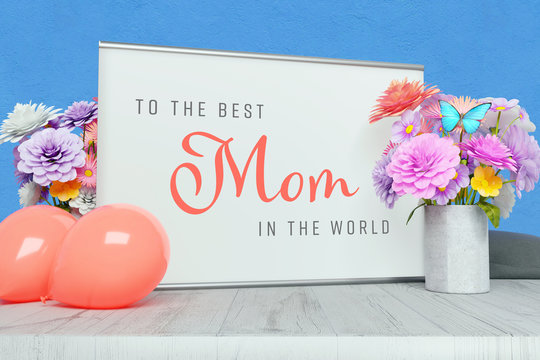Congratulations: To the best mom in the world! Writing on a picture frame surrounded by flowers and balloons as decoration. Pastel colours
