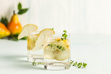 Festive summer drinks, pear thyme cocktail. Selective focus, space for text.