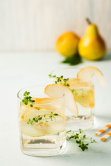 Pear thyme spritzer. Selective focus, space for text.