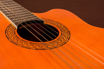 Rosette and strings of an acoustic guitar close up. Classical Spanish guitar. Musical instrument.