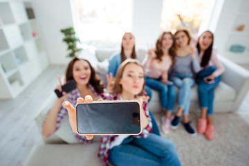 Above hign angle view of nice charming attractive cheerful cheery ladies taking making selfie showing v-sign in light white interior room indoors