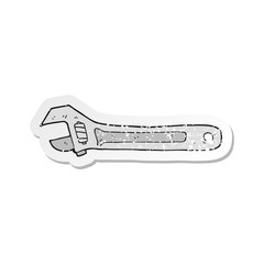 retro distressed sticker of a cartoon spanner