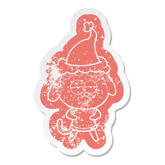 cartoon distressed sticker of a bored dog wearing santa hat