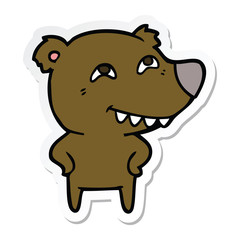 sticker of a cartoon bear showing teeth