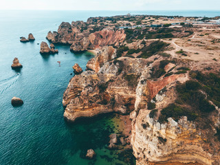 Ocean Landscape With Rocks And Cliffs At Lagos Bay Coast In Algarve, Portugal