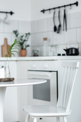 White chair beside round table