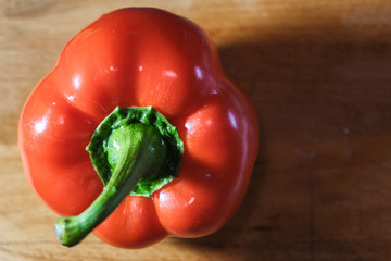fresh red pepper on wooden cutting Board