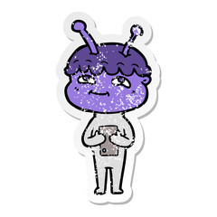distressed sticker of a friendly cartoon spaceman