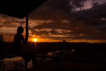 jung women enjoying beautiful sunset in the australian outback with 1 lakes, Nitmiluk National...