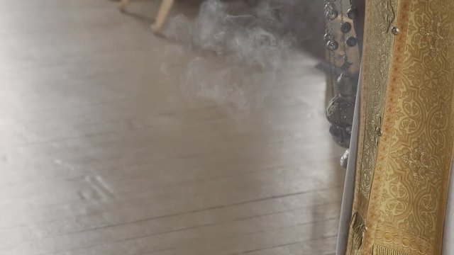 orthodox censer with incense smoke.