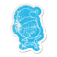 cartoon distressed sticker of a annoyed man wearing santa hat