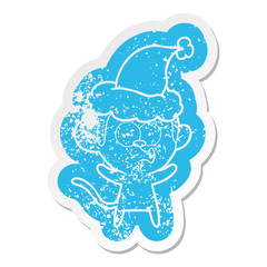 cartoon distressed sticker of a surprised monkey wearing santa hat