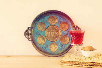 Pesah celebration concept (jewish Passover holiday). Translation for Hebrew Text over plate: (PESAH) PASSOVER