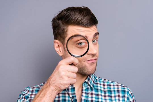 Close up photo attractive amazing macho he him his man I watch you concept big lupa hand arm childish playful wearing casual plaid checkered shirt outfit isolated grey background