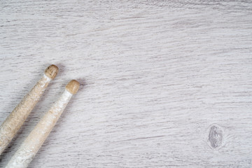 White drum sticks on gray background