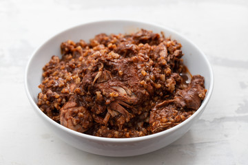rice with rabbit and sauce in dish