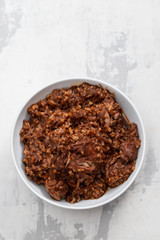 rice with rabbit and sauce in dish