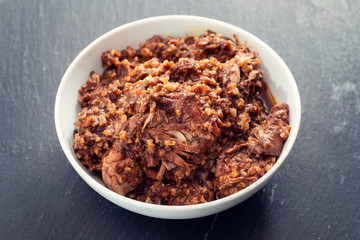rice with rabbit and sauce in dish