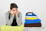 stressed man ironing clothes
