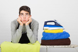 stressed man ironing clothes