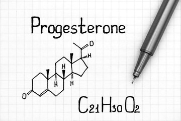 Chemical formula of Progesterone with pen.