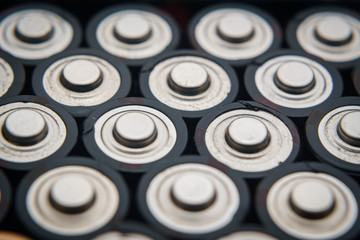 Stack og batteries in white 