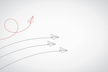 Think differently concept. Red airplane changing direction. New idea, change, trend, courage, creative solution, innovation and unique way concept.