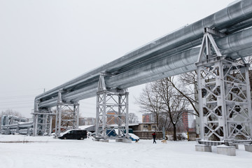 Huge gas pipeline laid along snowy street in Riga, Latvia