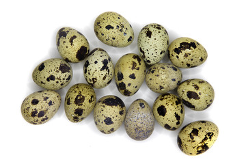 Fototapeta premium Several quail eggs isolated on white, with shadows