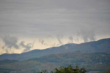 clouds like smoke form mountains in a winter cold day