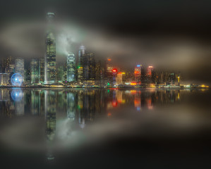 Fototapeta na wymiar Skyline of Hong Kong in mist, view from Kowloon island, China