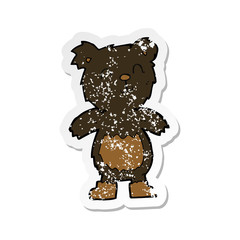 retro distressed sticker of a cartoon teddy black bear
