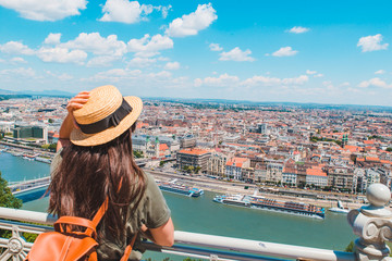 young stylish woman looking at panoramic view of budapest city