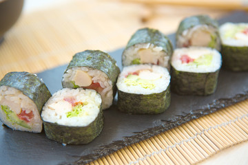 Sushi Set nigiri and sushi rolls on gray stone slate on stone background. Sushi menu. Japanese food.