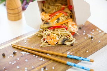 Chinese food . Noodles with shrimp, vegetables and sesame with soy sauce