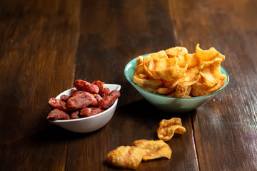 chipss in a bowl on a wooden table
