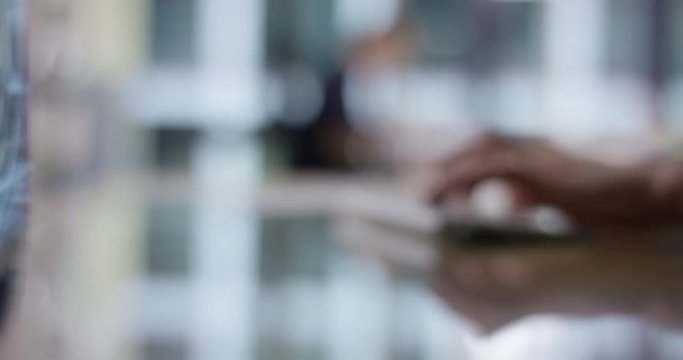 Blurry shot of elegant hands typing on keyboard