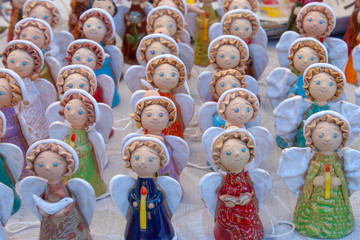 Many colored clay figures stand on the table