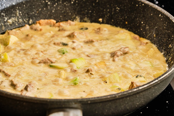 Cheese sauce with meat and zucchini