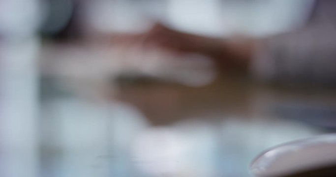 Blurry image of person typing, perfect to use as template or background