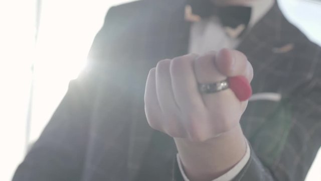 Professional magician shows tricks with paralon hearts. Merger.