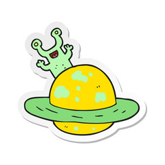 sticker of a cartoon alien planet