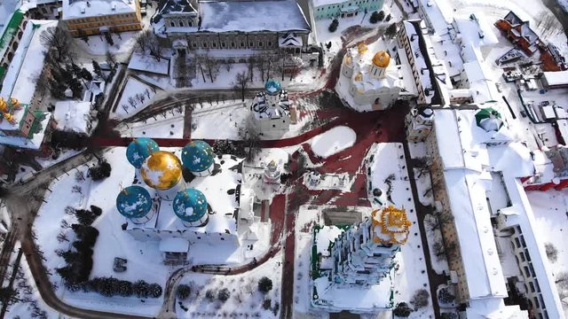 Flying in winter in snowy weather over the Holy Trinity Sergius Lavra (Russia). Many churches in the fortress.