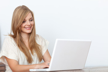 Young woman using a notebook computer indoors