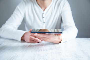 young man hand holding phone