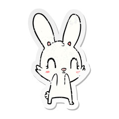 distressed sticker of a cute cartoon rabbit