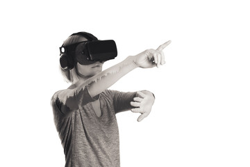 A young woman is wearing virtual reality glasses and touching air during the VR experience isolated on white