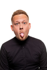Close up portrait of a confident, blond, handsome young man wearing black shirt, isolated on white background
