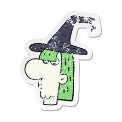 retro distressed sticker of a cartoon witch head